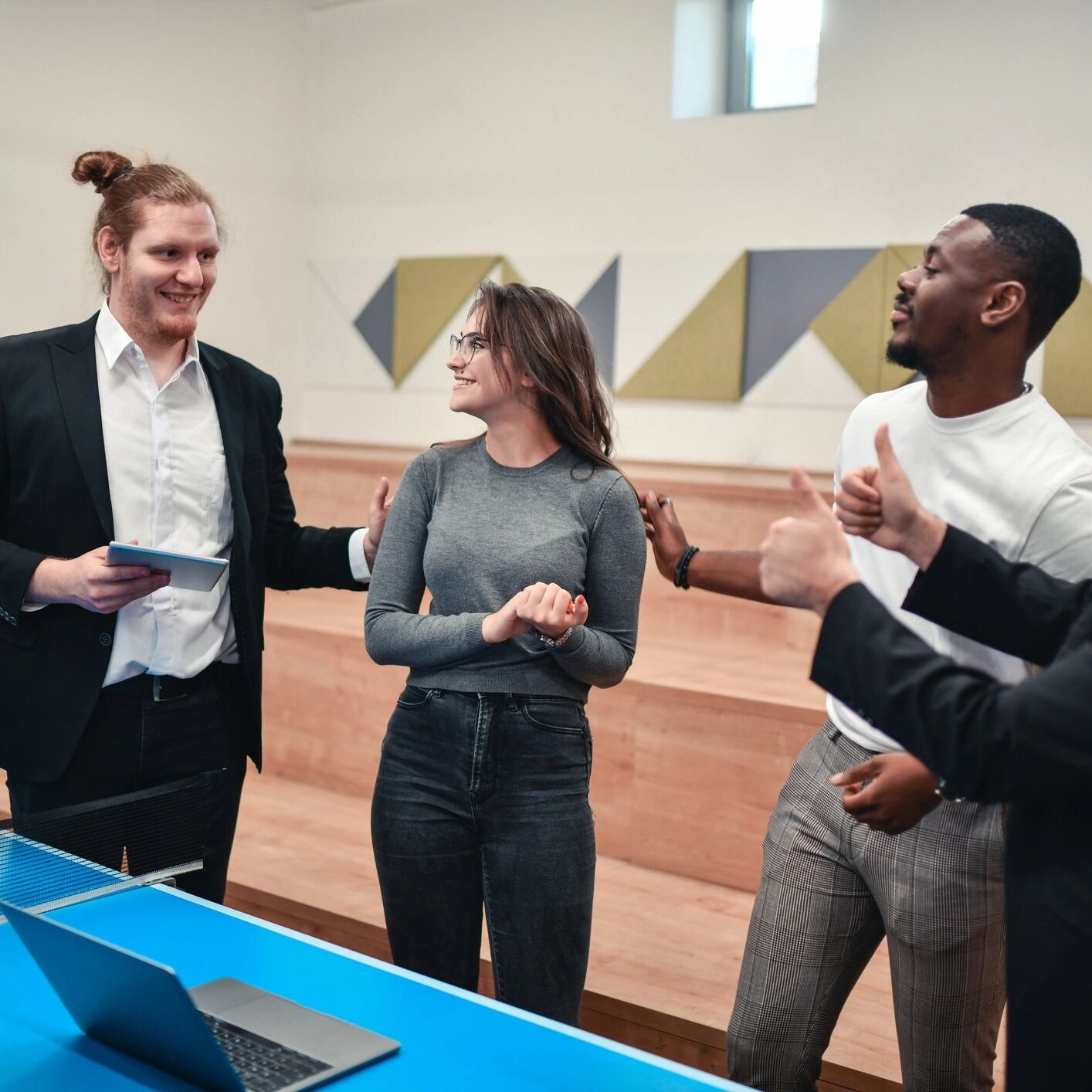 Colleagues celebrating success together in the workplace