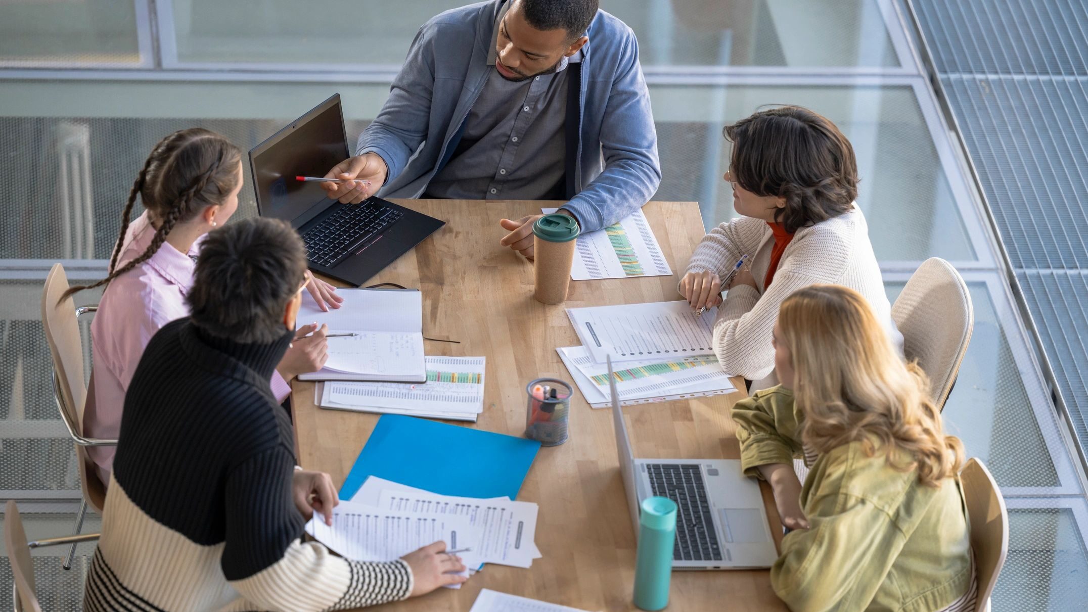 Professionals collaborating in a modern office meeting